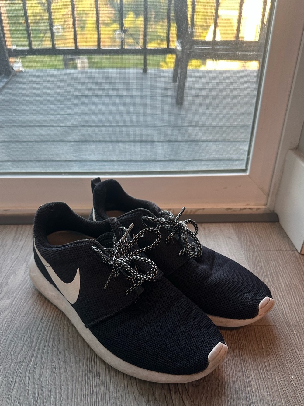 Nike Women’s Black Athletic Sneakers with White Swoosh